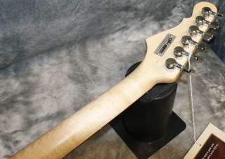   clear red body swamp ash with twin voice chambers on the left and