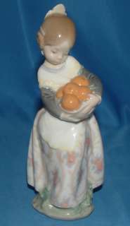 Lladro girl with apples  7 figurine  
