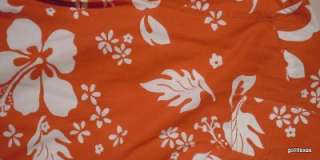  King Size. It is a bright orangy red with white flowers and leaves 