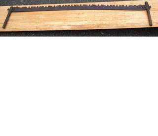 terrific antique crosscut saw Has its 2 original wooden handles 